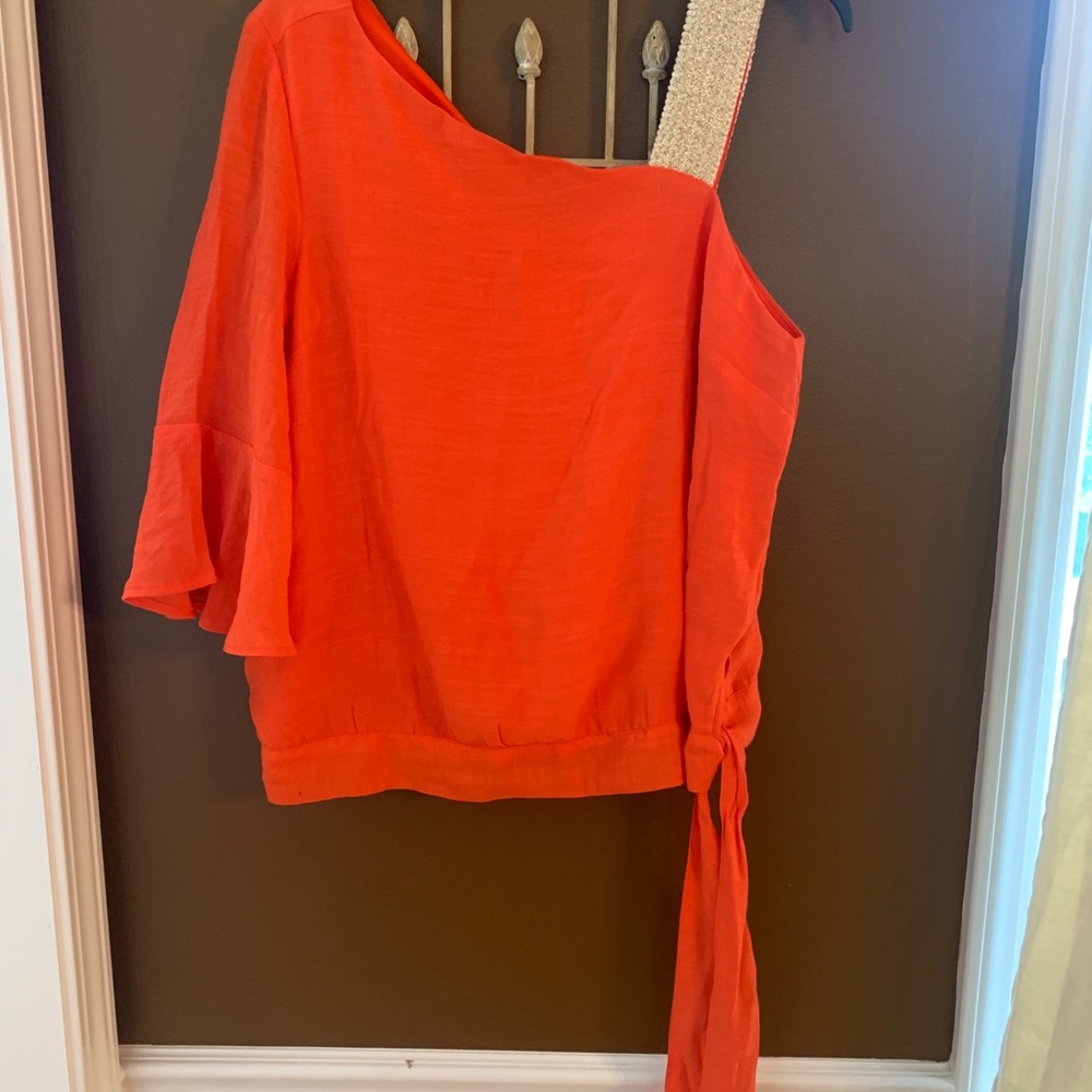 One fluted sleeve top w gold shoulder strap and tie at waist